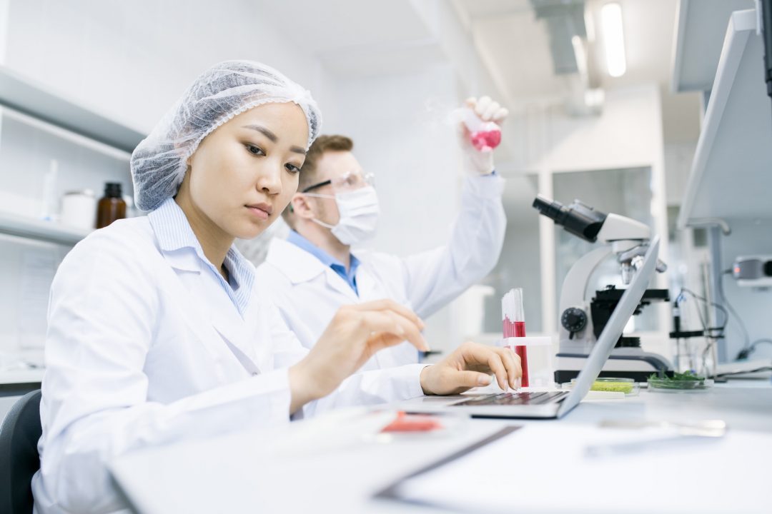 Two Modern Scientists Doing Research in Laboratory